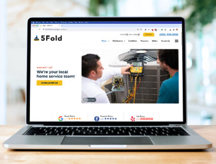 The image shows a laptop screen with a website we built for an HVAC company.